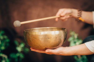 hand holding a meditation bowl