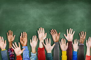 group of kids arms and hands waving