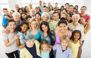 large group of people smiling at the camera