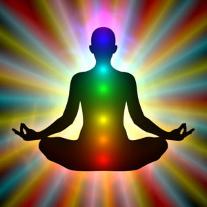 meditation silouette with radiating chakra colors
