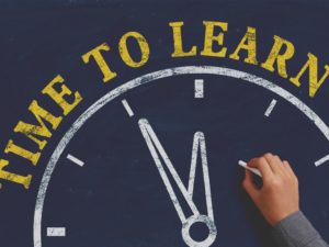 time to learn clock on chalkboard